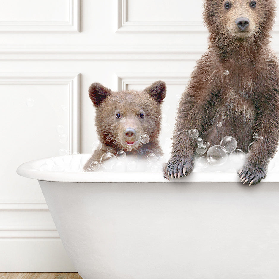 two brown bears are sitting in a bathtub