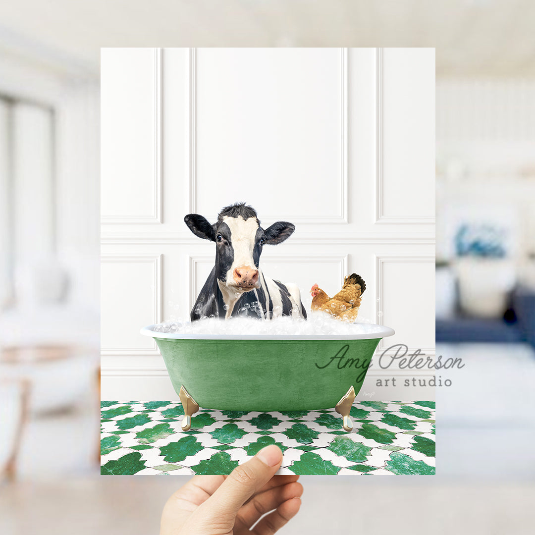 a hand holding up a card with a picture of a cow in a bathtub