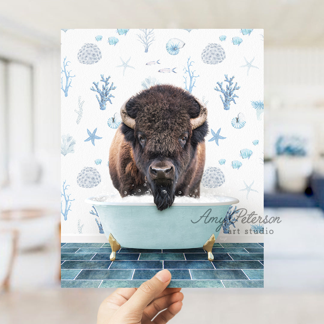 a hand holding up a card with a picture of a bison in a bathtub