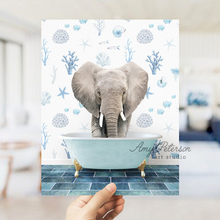 a person holding up a picture of an elephant in a bathtub