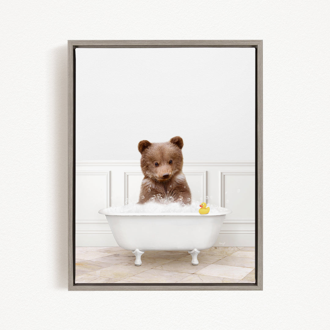 A brown bear sitting in a white bathtub filled with bubbles, with a rubber duck floating on the water.