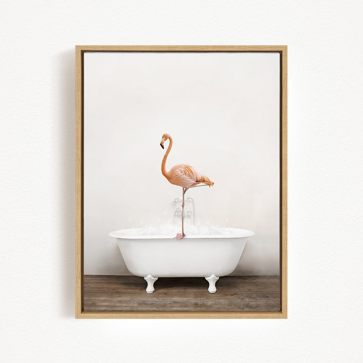 A pink flamingo standing on the edge of a white bathtub filled with water.