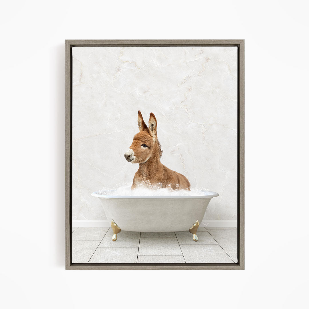 A donkey is sitting in a white bathtub filled with water, creating a playful and whimsical scene.