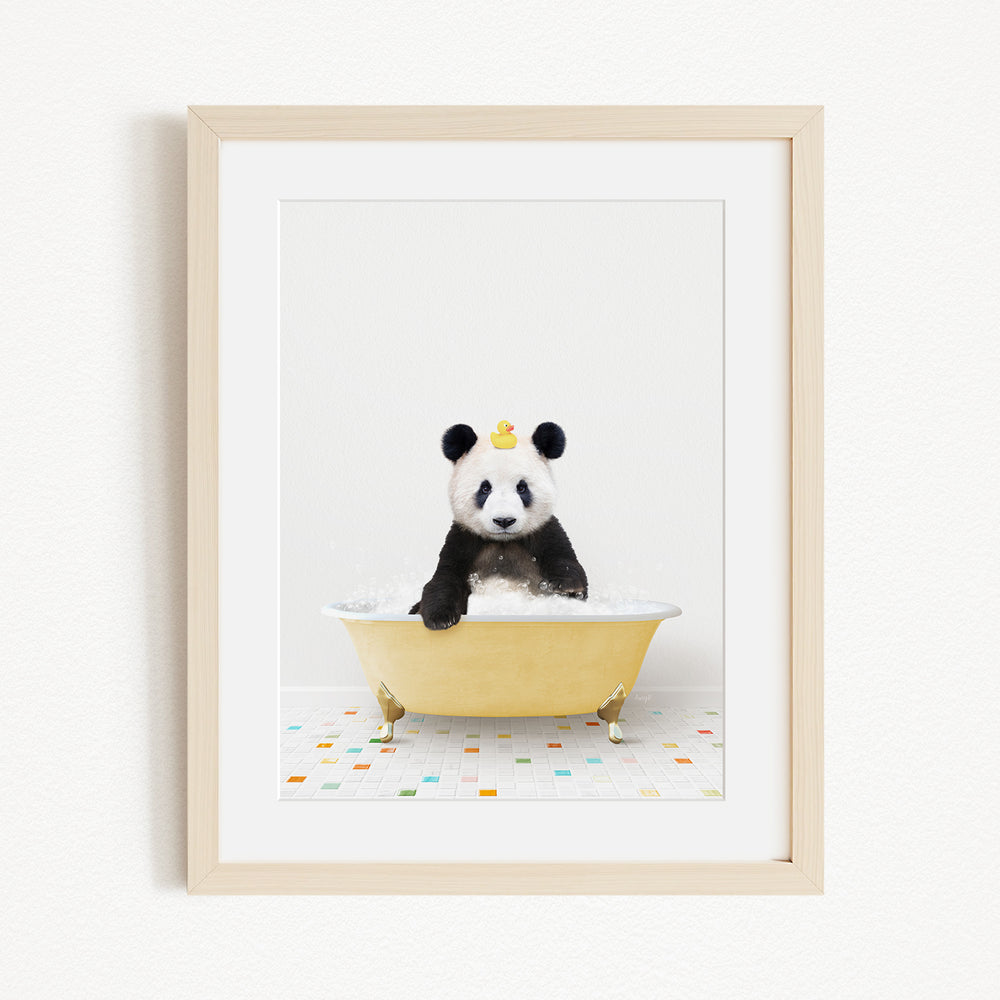 A panda bear sitting in a yellow bathtub, with a rubber duck on its head.