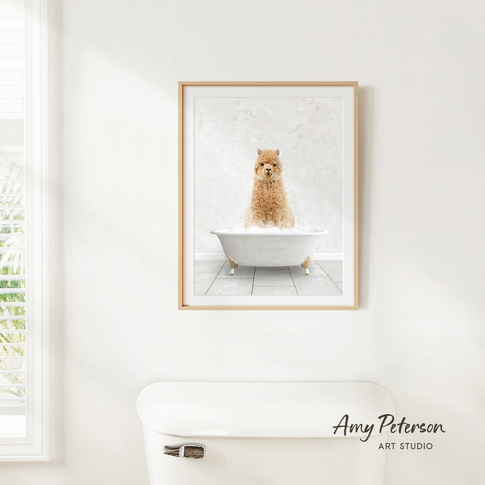 A framed print of a dog sitting in a bathtub is hanging on a white wall above a white toilet.