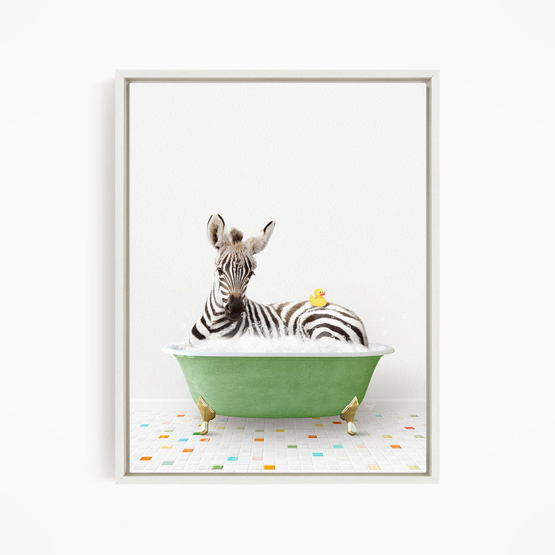 A zebra is sitting in a green bathtub, with a yellow rubber duck resting on its back.
