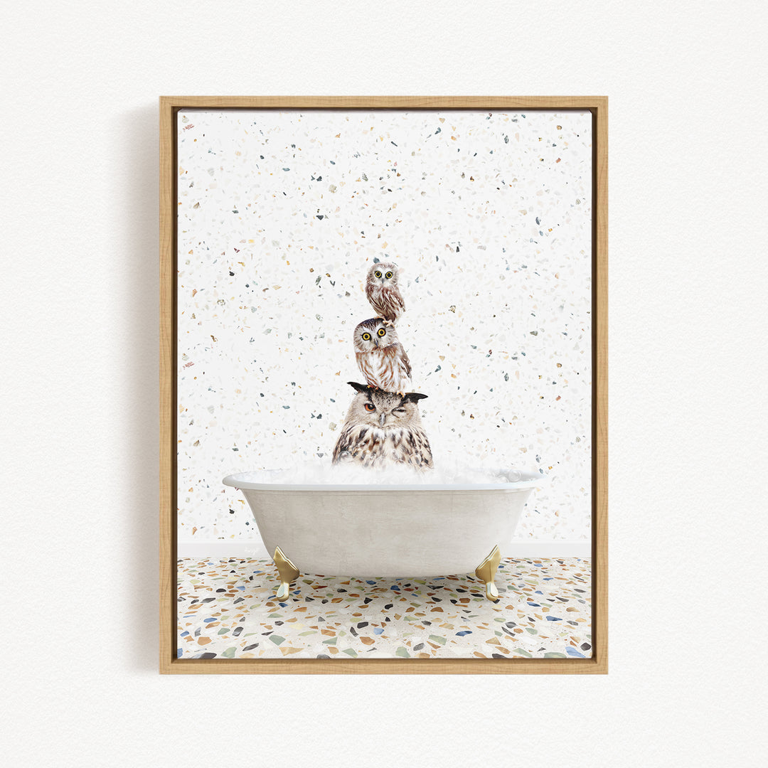 A framed image depicting a group of owls sitting in a bathtub filled with water, creating a whimsical and playful scene.