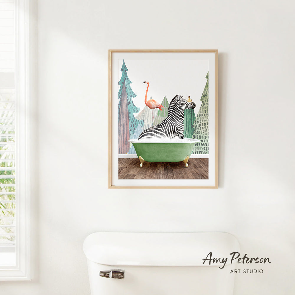 A framed illustration of a zebra sitting in a green bathtub, with a pink flamingo perched on the zebra's back.
