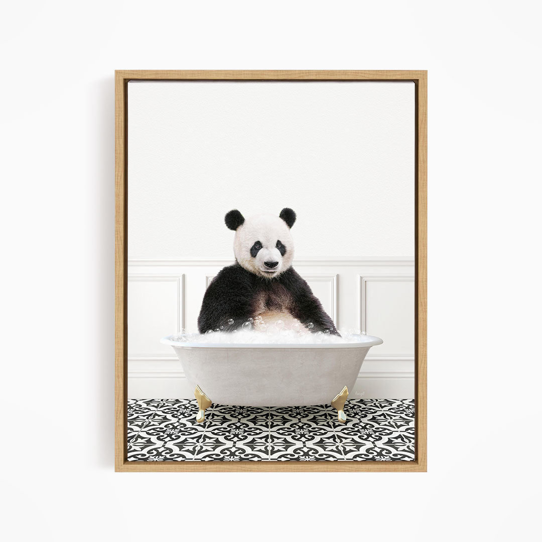 A panda bear sitting in a white bathtub filled with bubbles, surrounded by a black and white patterned floor.