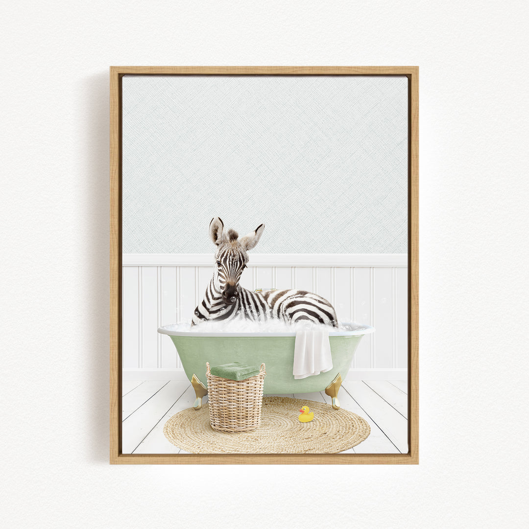 A zebra is sitting in a green bathtub filled with water, surrounded by a basket and a rubber duck.