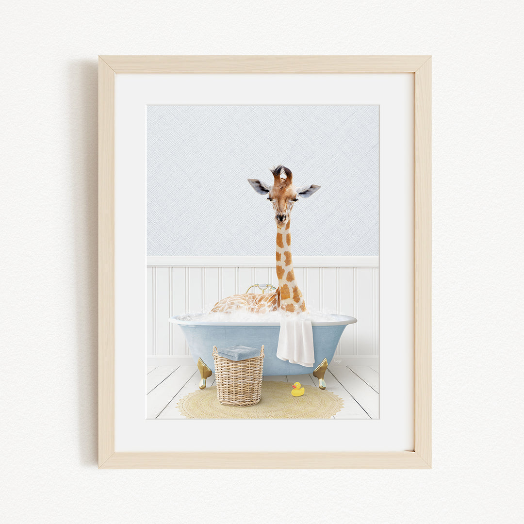 A giraffe standing in a blue bathtub filled with water, surrounded by a yellow rubber duck and a basket.