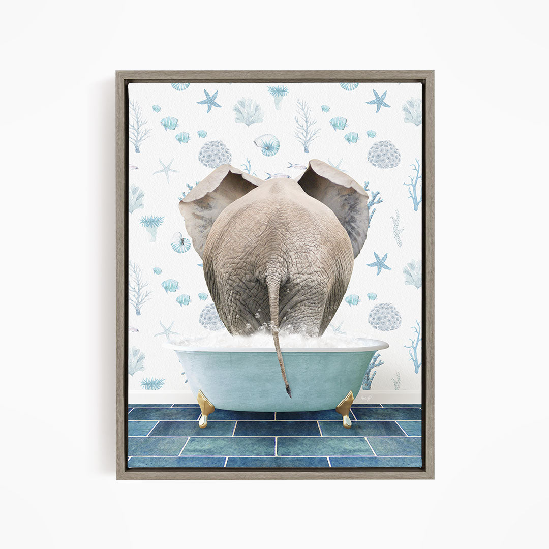 An elephant is sitting in a bathtub filled with water, surrounded by blue and white floral patterns.