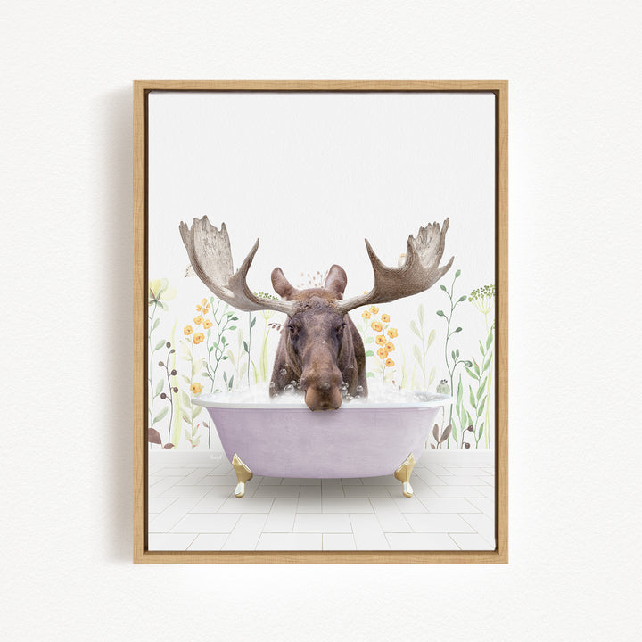 A moose with large antlers is sitting in a bathtub filled with water, surrounded by flowers and plants.