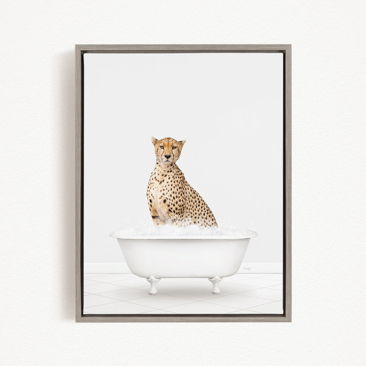 A cheetah sitting in a white bathtub filled with water.