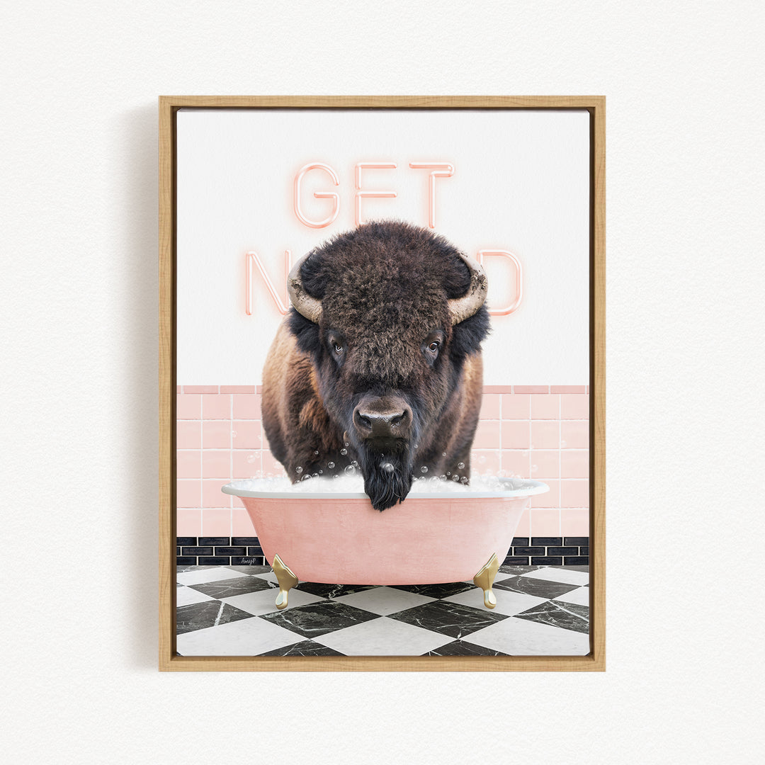 A buffalo is sitting in a pink bathtub, with the words "GET NICKED" written on the wall behind it.