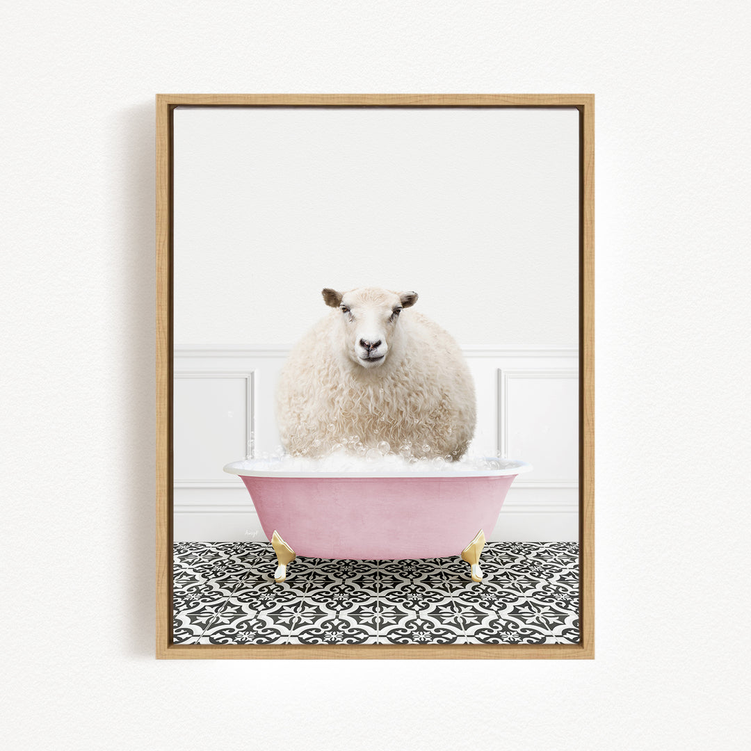 A fluffy white sheep sits in a pink bathtub filled with bubbles, surrounded by a black and white patterned floor.