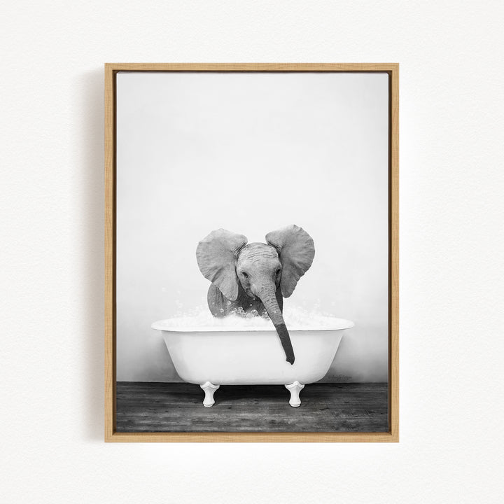 A baby elephant sitting in a white bathtub filled with water, creating a playful and whimsical scene.