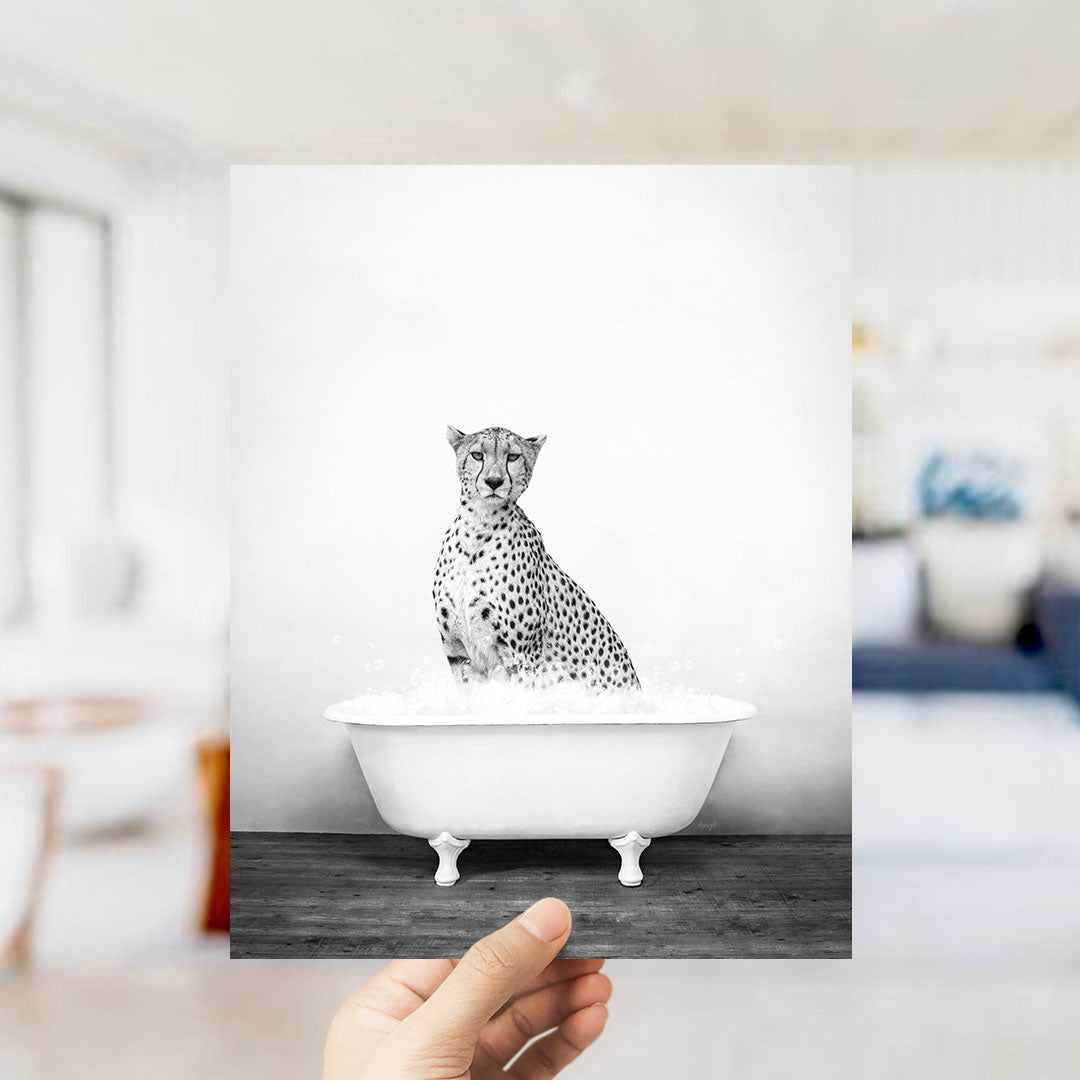 A cheetah sitting in a bathtub filled with water, as if taking a bath.