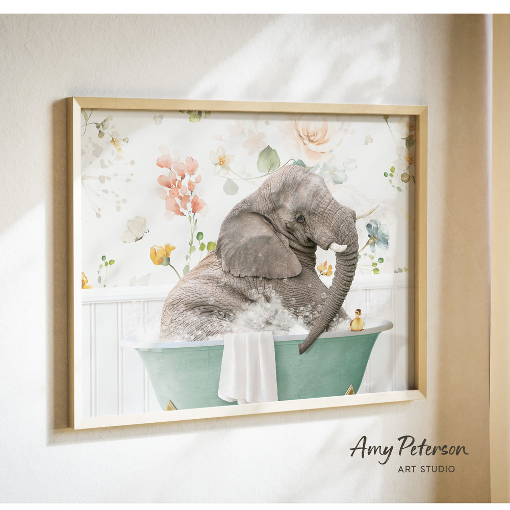 A framed print of an elephant sitting in a bathtub filled with water, surrounded by flowers and other decorative elements.