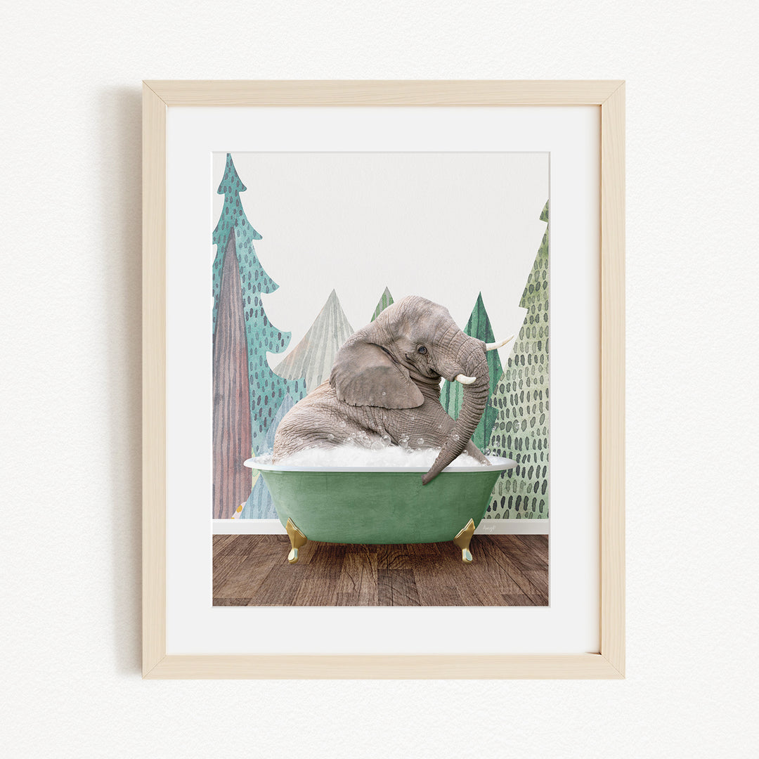 A gray elephant is sitting in a green bathtub, surrounded by a forest-like background with trees and a snowy landscape.