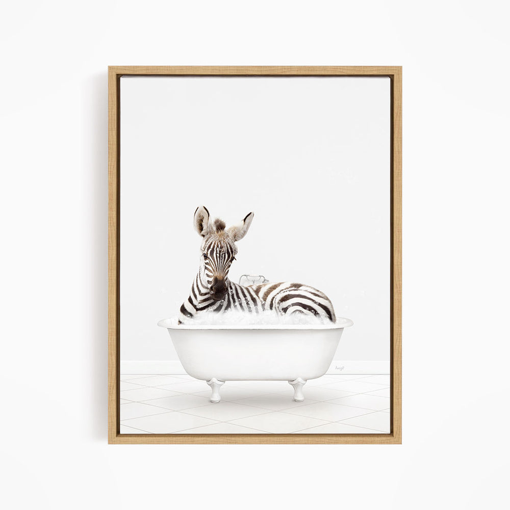 A zebra is sitting in a white bathtub, surrounded by bubbles, creating a whimsical and playful scene.