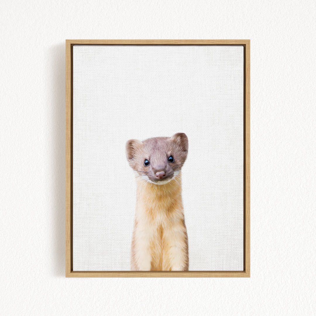 A small, furry animal with a curious expression is the focus of the image, which is framed and displayed on a white wall.
