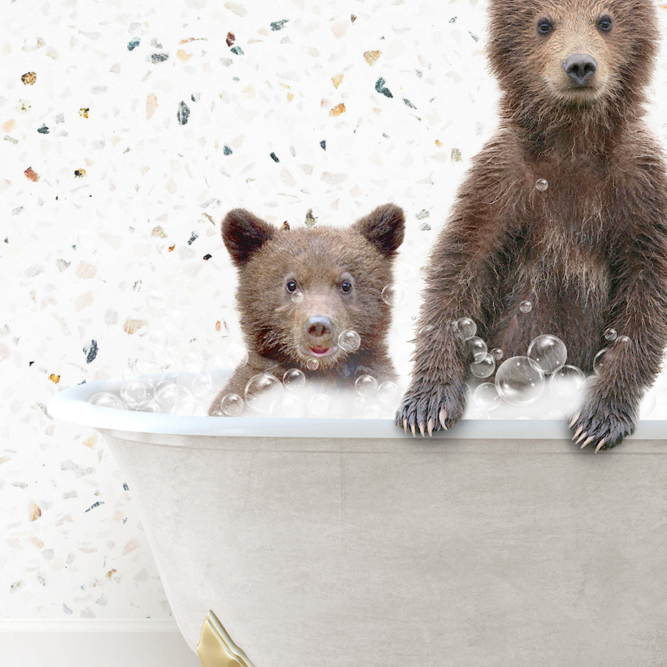 a couple of brown bears sitting inside of a bath tub