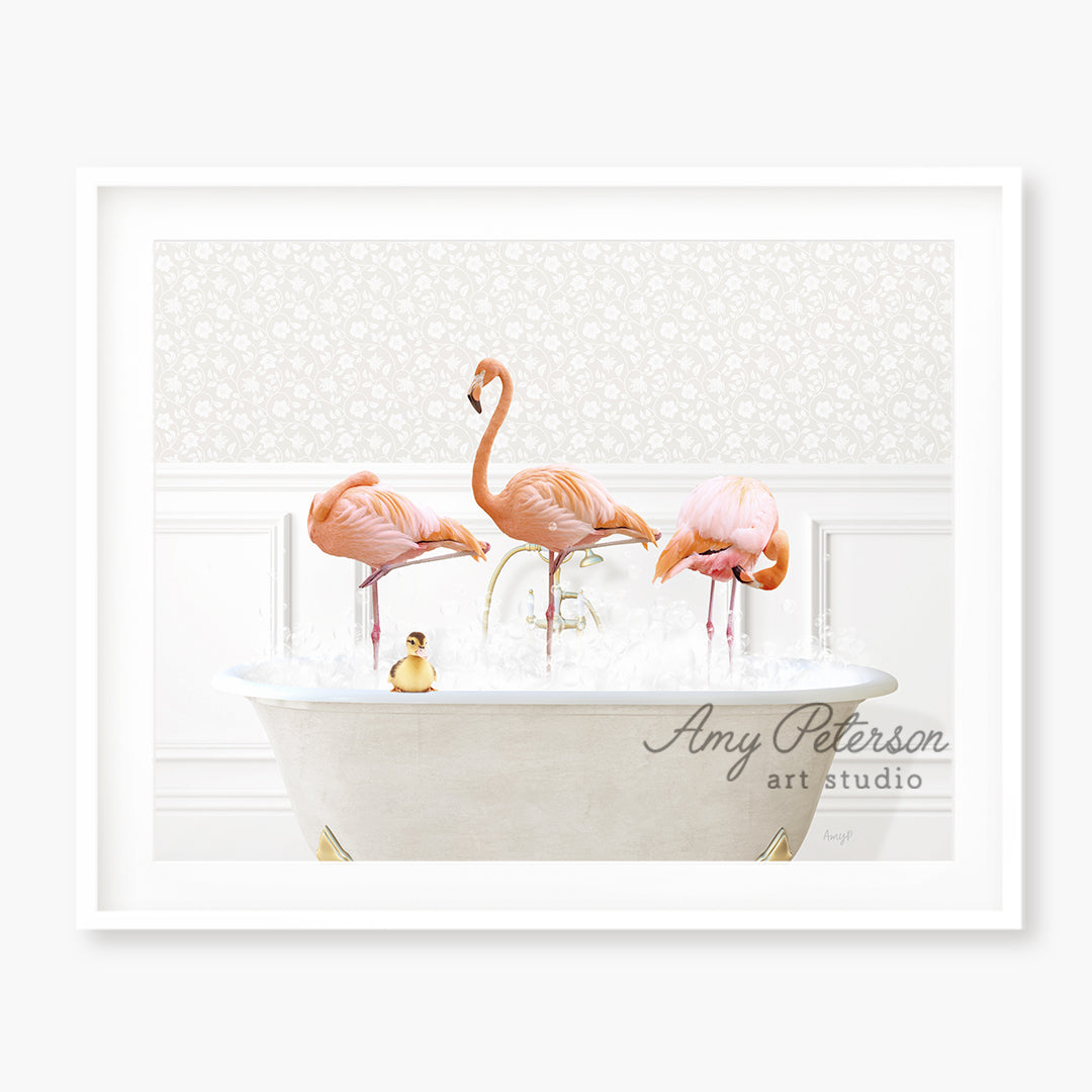 three pink flamingos in a bathtub with bubbles