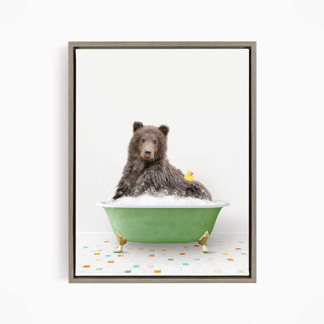 A brown bear sitting in a green bathtub, with a yellow rubber duck floating next to it.