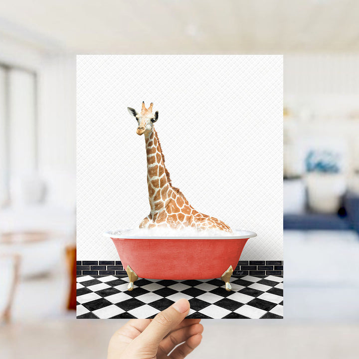 A giraffe sitting in a red bathtub on a black and white checkered floor.