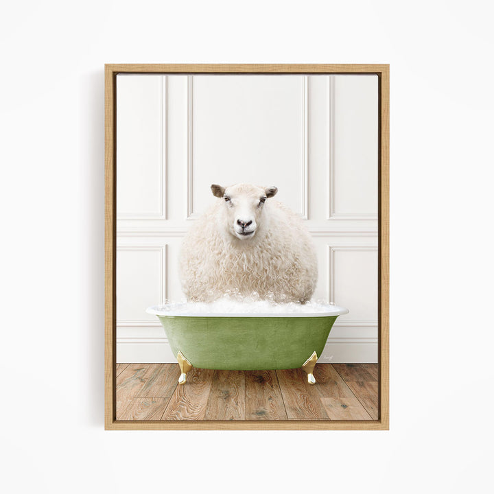 A fluffy white sheep sits in a green bathtub filled with bubbles, looking directly at the camera.
