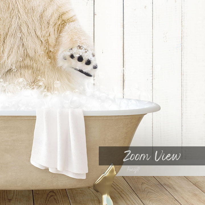 A polar bear is standing in a bathtub filled with bubbles, with a towel hanging on the side and a "Zoom View" label below the image.