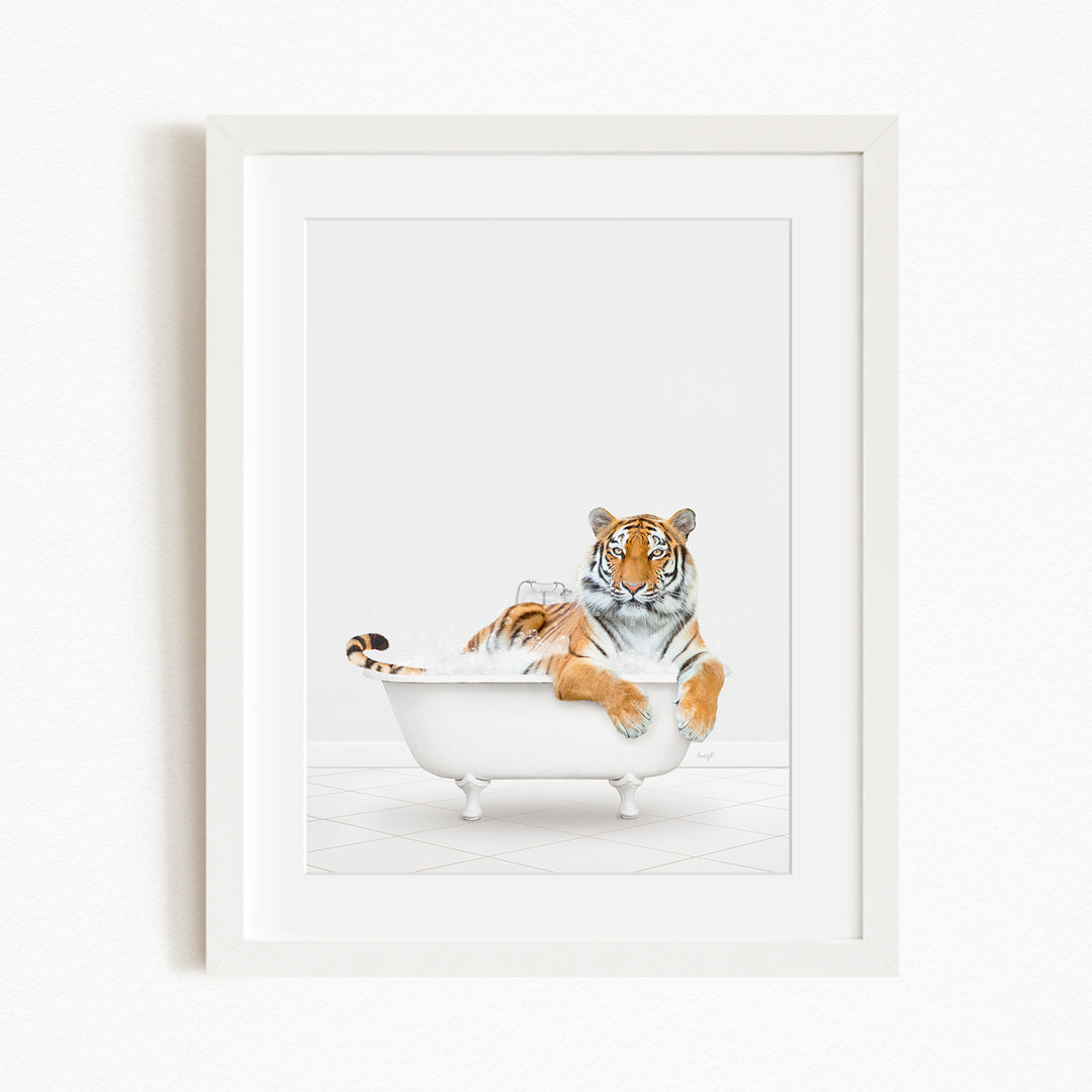 A tiger is sitting in a white bathtub filled with water, appearing relaxed and enjoying the bath.