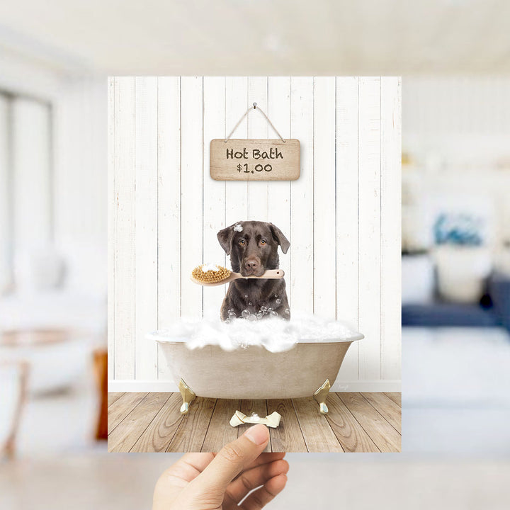 A brown dog is sitting in a bathtub filled with bubbles, holding a brush in its mouth, with a sign above that says "Hot Bath $1.00".