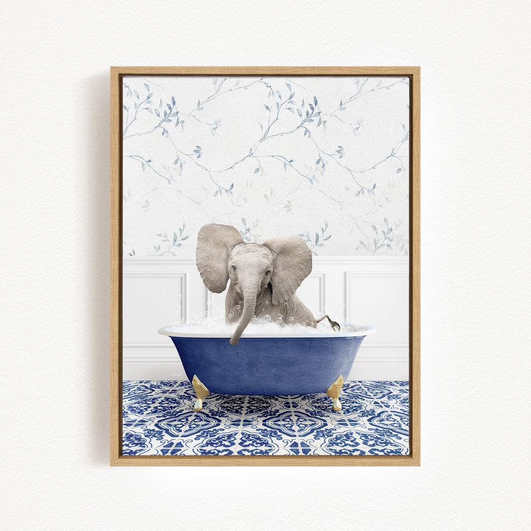 A baby elephant sitting in a blue bathtub filled with water, surrounded by a blue and white patterned tile floor.