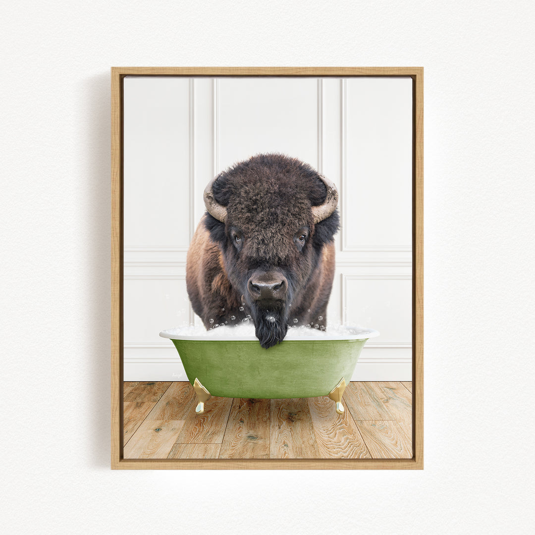 A buffalo with a black mane and horns is standing in a green bathtub filled with water, looking directly at the camera.