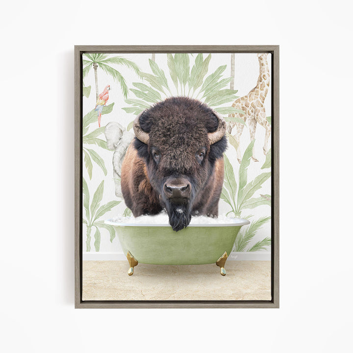 A buffalo is sitting in a green bathtub, surrounded by tropical plants and a giraffe in the background.
