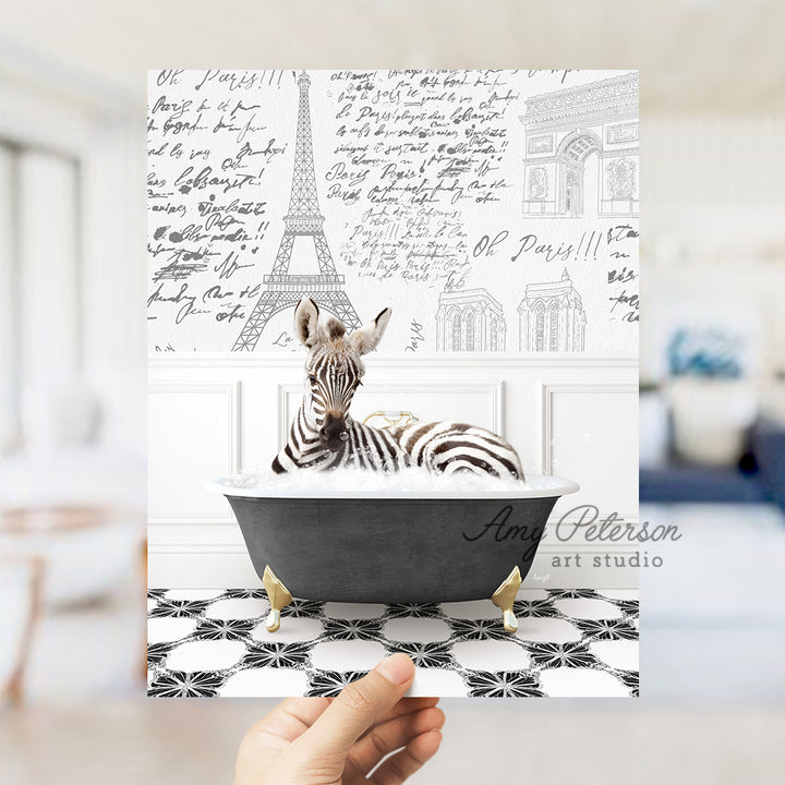 a person holding up a card with a zebra in a bathtub