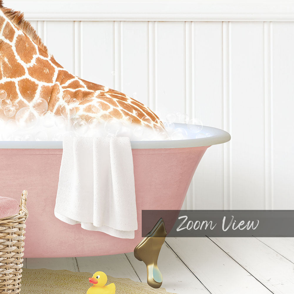 A giraffe is sitting in a pink bathtub filled with water, surrounded by a yellow rubber duck and a white towel.