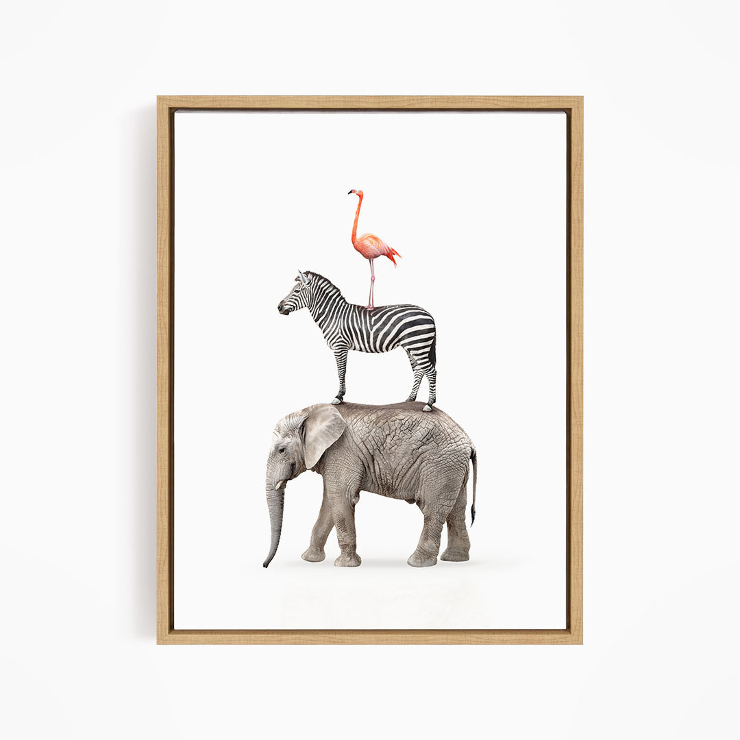 A framed image depicting a zebra, an elephant, and a flamingo standing together.