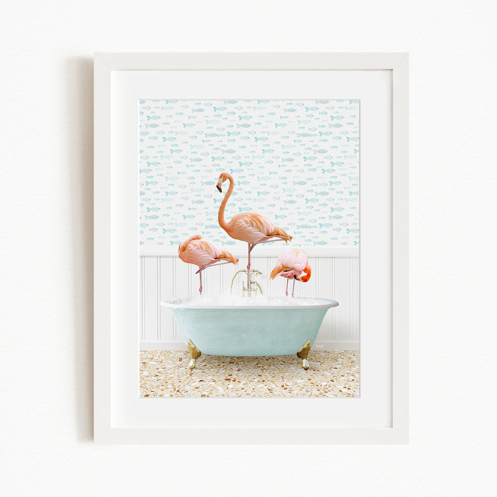 A framed image depicting three flamingos standing in a bathtub filled with water, with a patterned wall behind them.