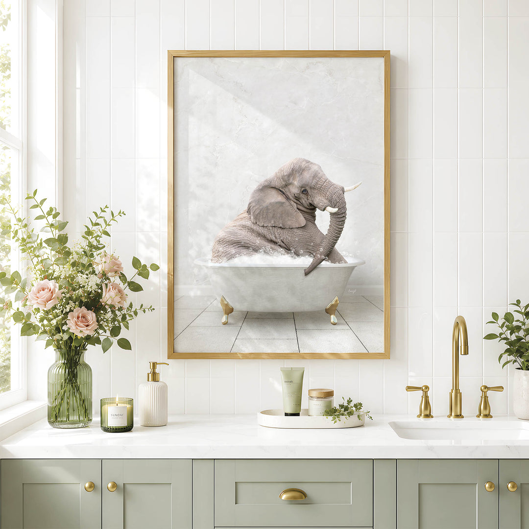 a bathroom with a framed picture of an elephant sitting in a bathtub, surrounded by flowers and candles.