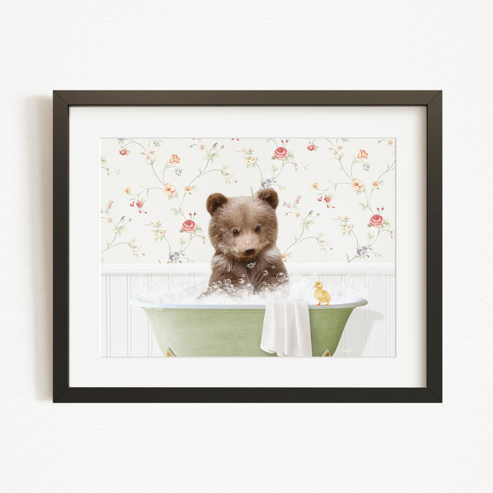 A cute brown bear sitting in a green bathtub filled with bubbles, surrounded by a floral wallpaper.