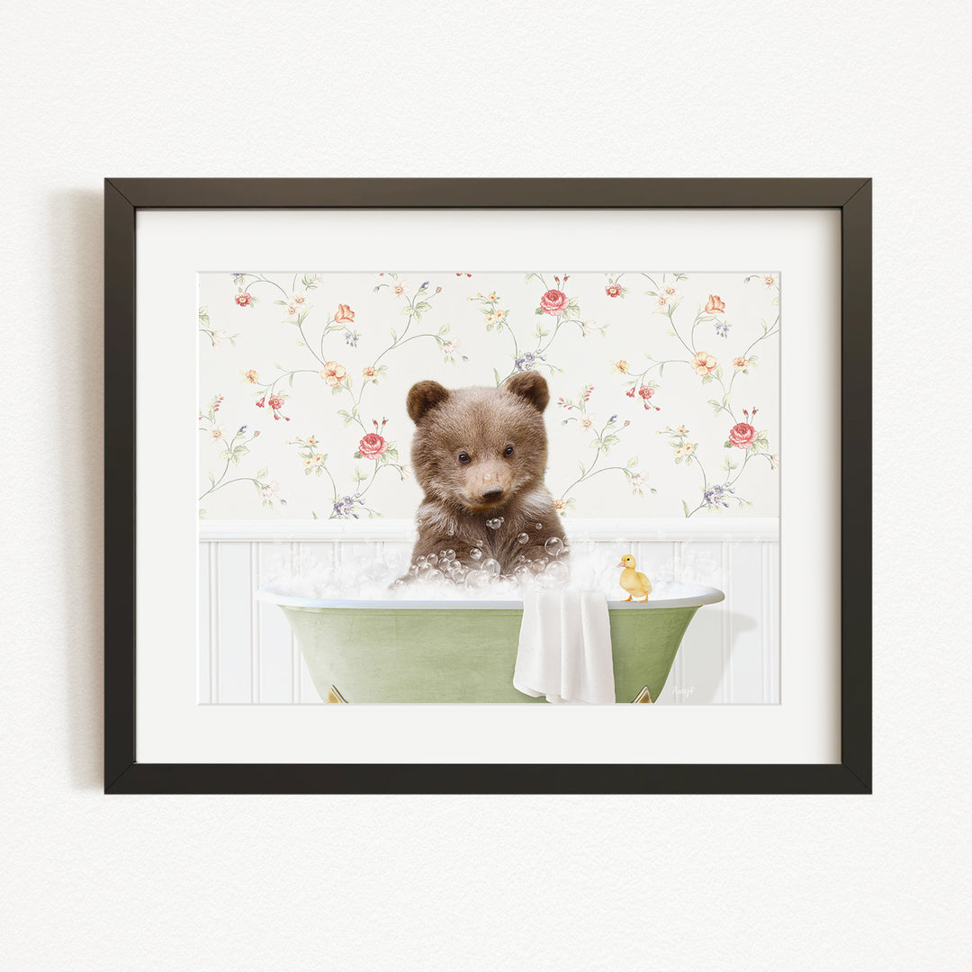 A cute brown bear sitting in a green bathtub filled with bubbles, surrounded by a floral wallpaper.