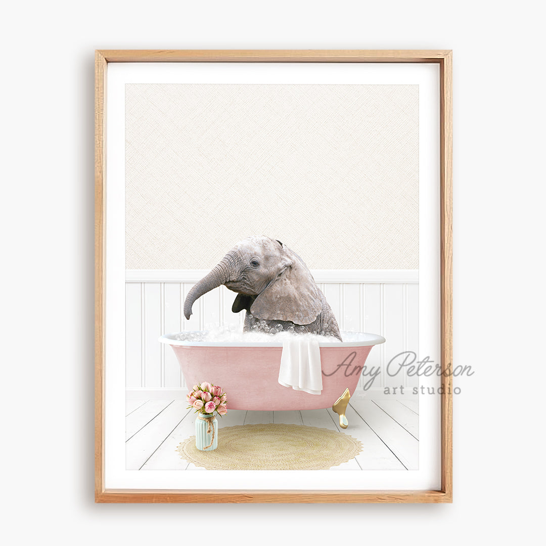 a picture of an elephant taking a bath in a pink bathtub