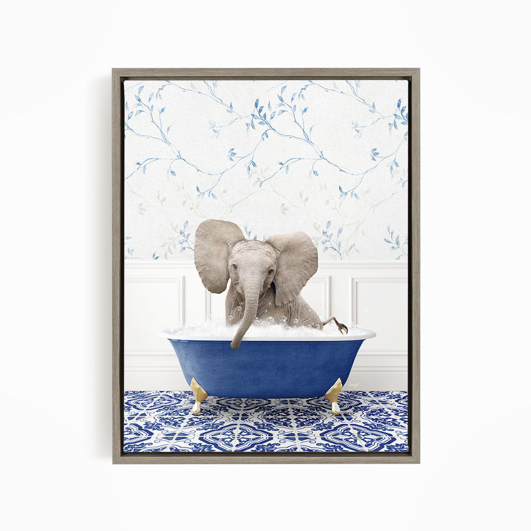 A gray elephant is sitting in a blue bathtub filled with water, surrounded by a blue and white patterned floor.