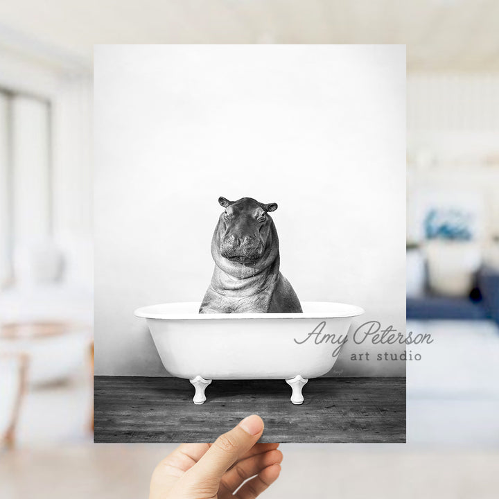 a black and white photo of a hippo in a bathtub