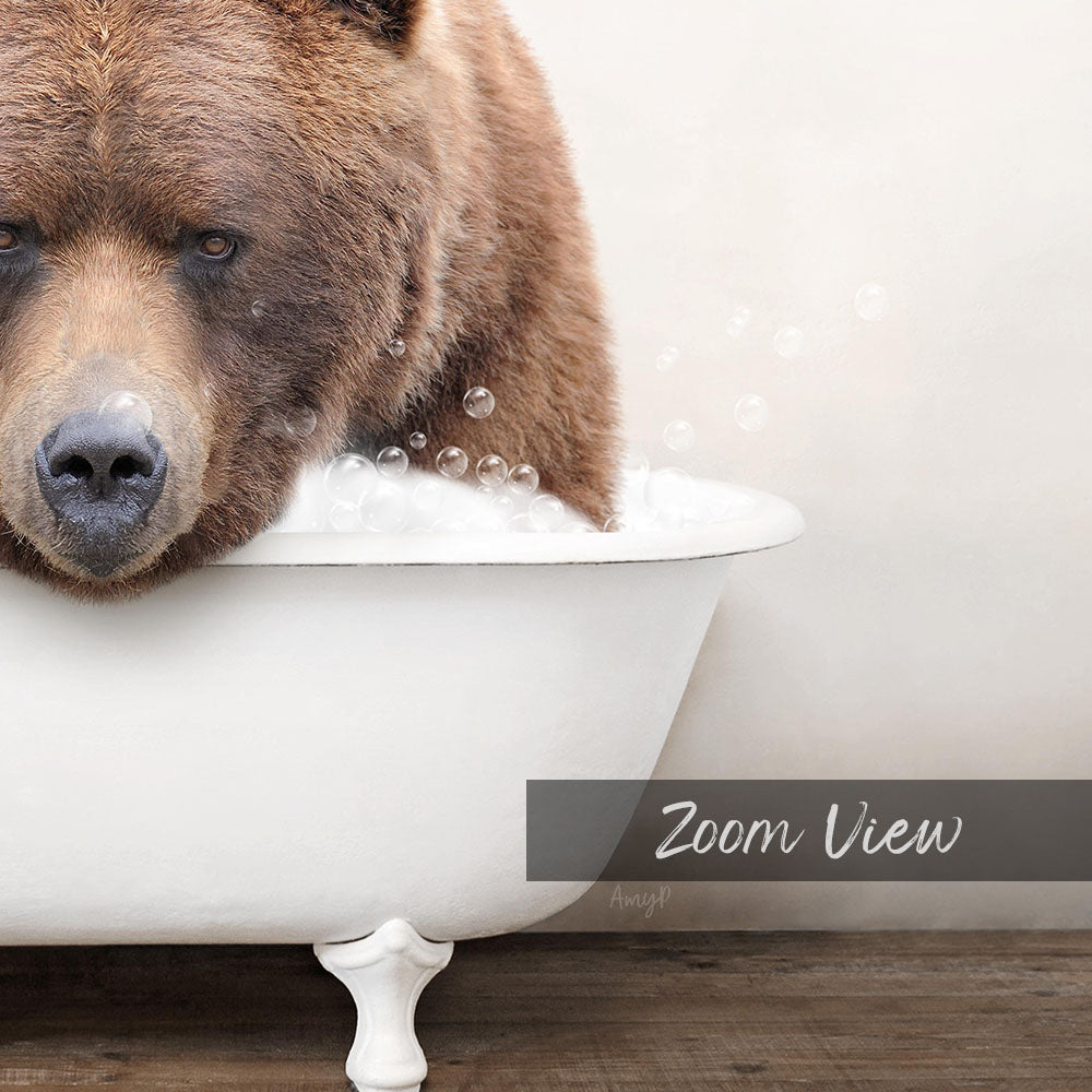 A brown bear is sitting in a white bathtub filled with bubbles, creating a whimsical and playful scene.