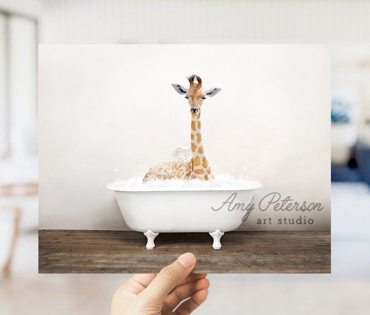 a giraffe is sitting in a bath tub