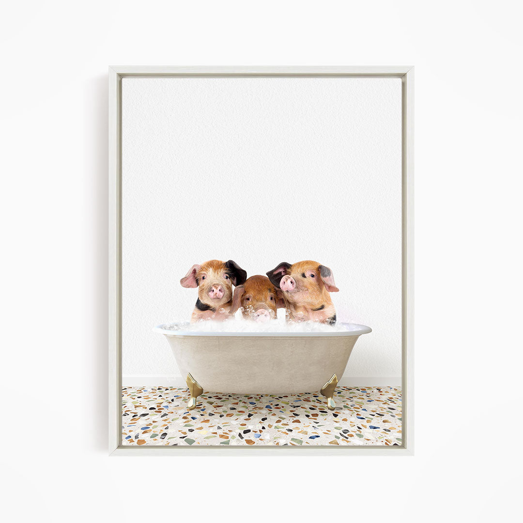Three adorable pigs sitting in a white bathtub, enjoying a relaxing bath.
